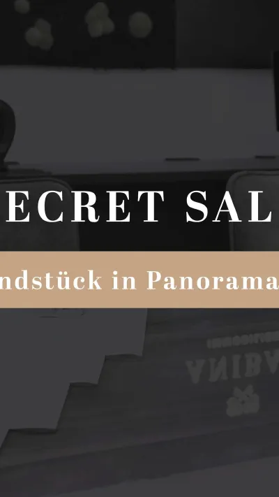 Sandro Anibas sitzt in einer luxuriösen Wohnung und schaut lächelnt von einer Zeitschrift auf