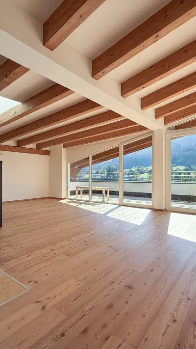 Sandro Anibas sitzt in einer luxuriösen Wohnung und schaut lächelnt von einer Zeitschrift auf